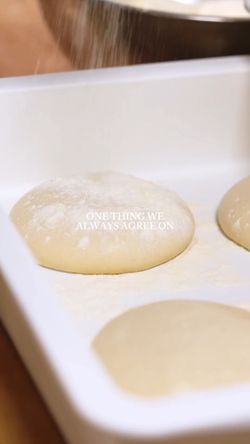Close-up of dough balls sprinkled with flour in a tray at Sparrow Italia Miami, representing fresh pasta preparation.